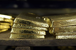 Gold Gains in Choppy Trade As Investors Digest Fed Strategy